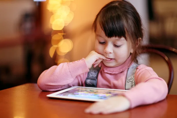 Baby girl with tablet PC — Stock Photo, Image