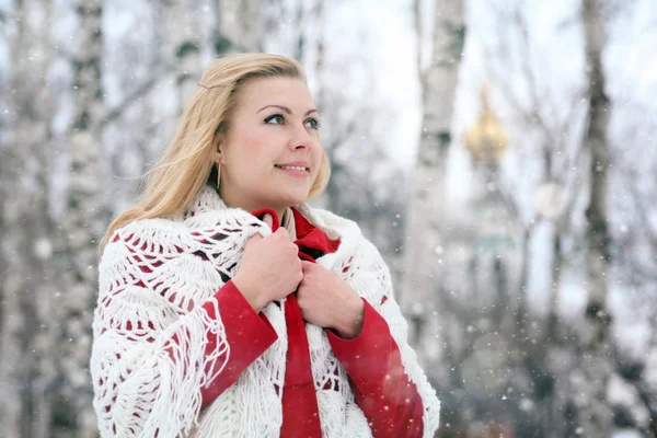 Blonde in shaw over birchwood — Stock Photo, Image