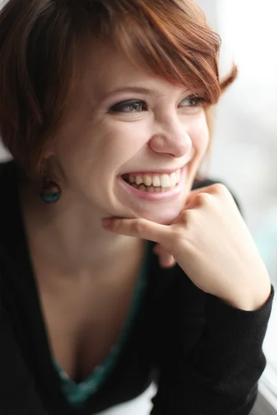 Girl on the windowsill — Stock Photo, Image