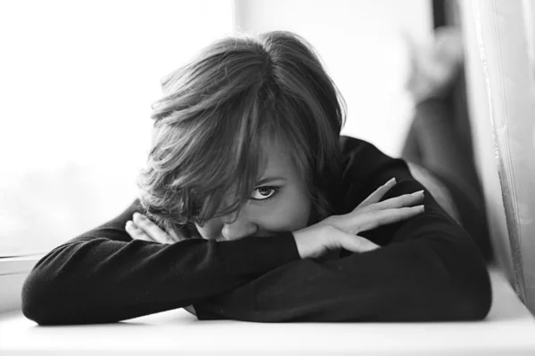 Girl on the windowsill — Stock Photo, Image