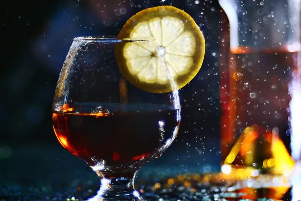 Cognac with lemon — Stock Photo, Image