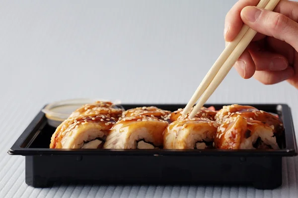 Sushi rolls and chopsticks — Stock Photo, Image