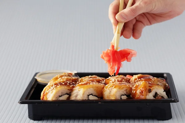 Sushi rolls and chopsticks — Stock Photo, Image