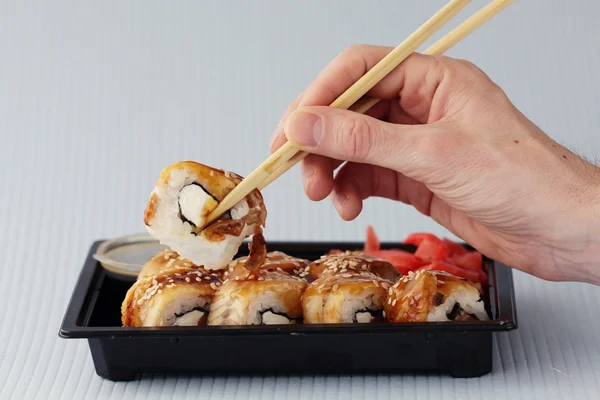 Sushi rolls and chopsticks — Stock Photo, Image