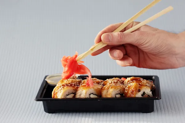 Sushi rolls and chopsticks — Stock Photo, Image