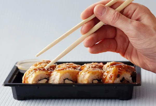 Sushi rolls and chopsticks — Stock Photo, Image