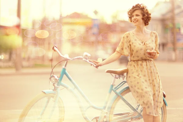 Girl with bicycle — Stock Photo, Image