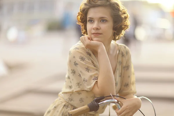 Girl with bicycle — Stock Photo, Image