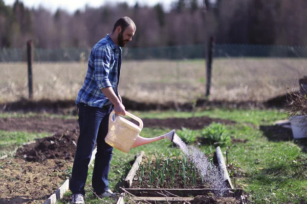 Man  with watering can — Stock Photo, Image