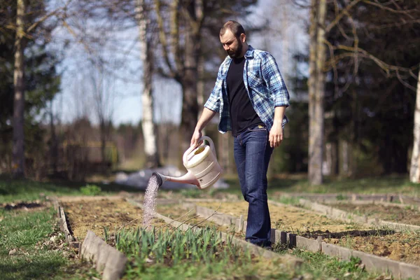 Man  with watering can — Stock Photo, Image