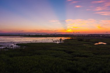 Sunset over Alabama Gulf Coast at Mobile Bay in July of 2022 