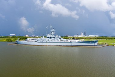 The USS Alabama battleship and the downtown Mobile, Alabama skyline in July 2022 