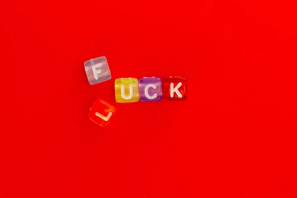 Flipped Colorful Plastic Cubes Changed Inscription Luck Fuck Red Background — 스톡 사진