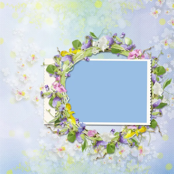 Frame with a wreath of flowers on a beautiful background — Stock Photo, Image