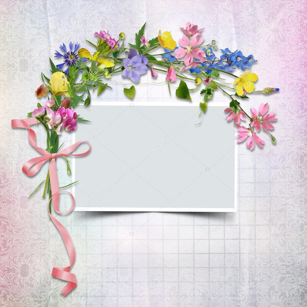 A bouquet of flowers with a frame on the vintage background