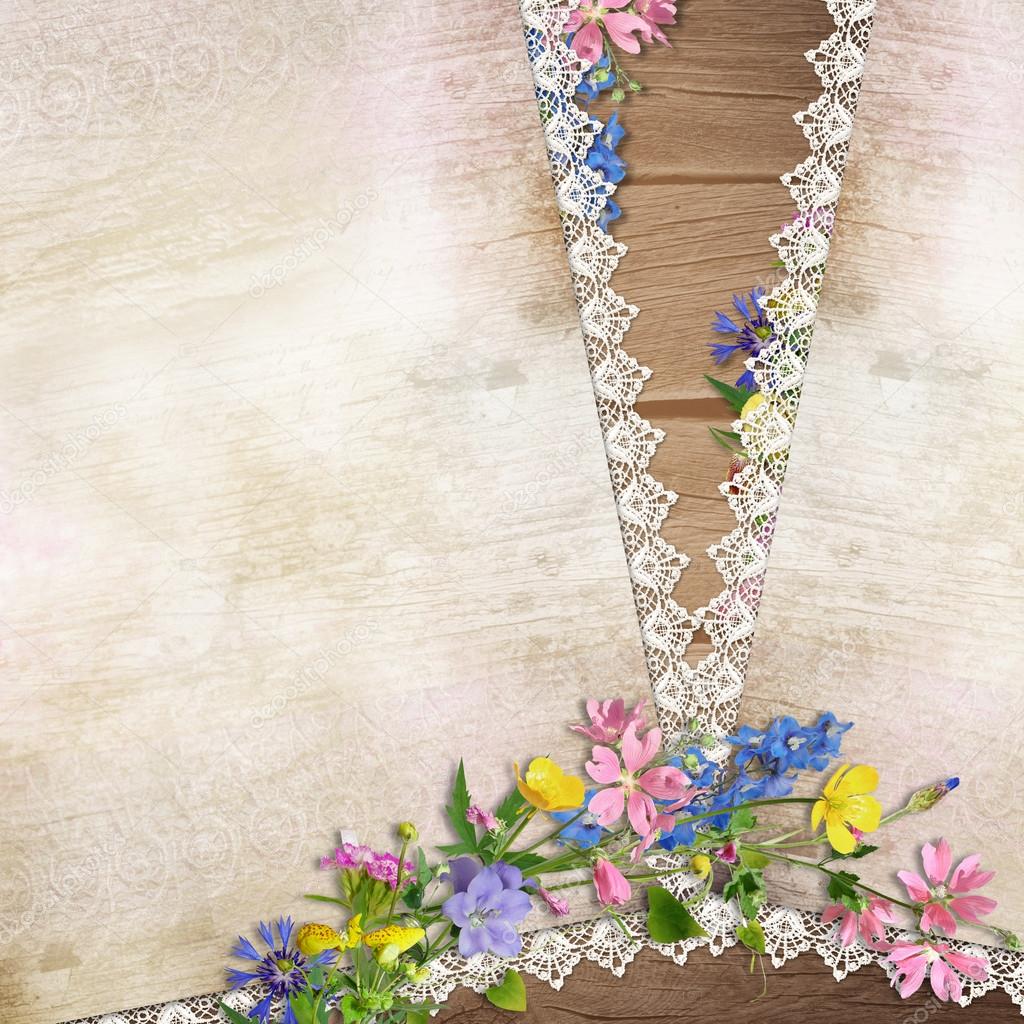 Flowers on the vintage background with lace