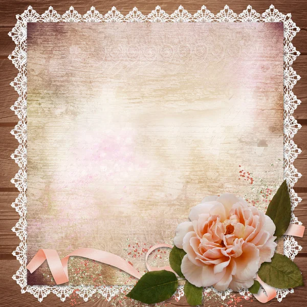 Rose with ribbon on vintage background — Stock Photo, Image