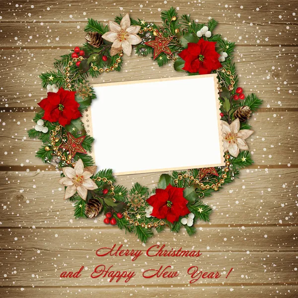 Christmas wreath with frame on wooden background — Stock Photo, Image