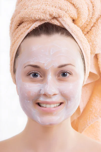 Beautiful girl's face with cream — Stock Photo, Image