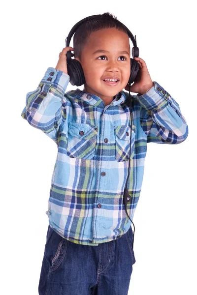 Asian little boy listening to music — Stock Photo, Image