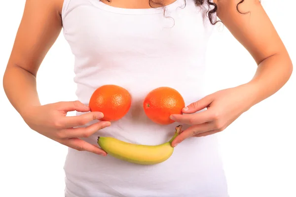 Young woman holding orange and banana. Isolated over white — Stock Photo, Image