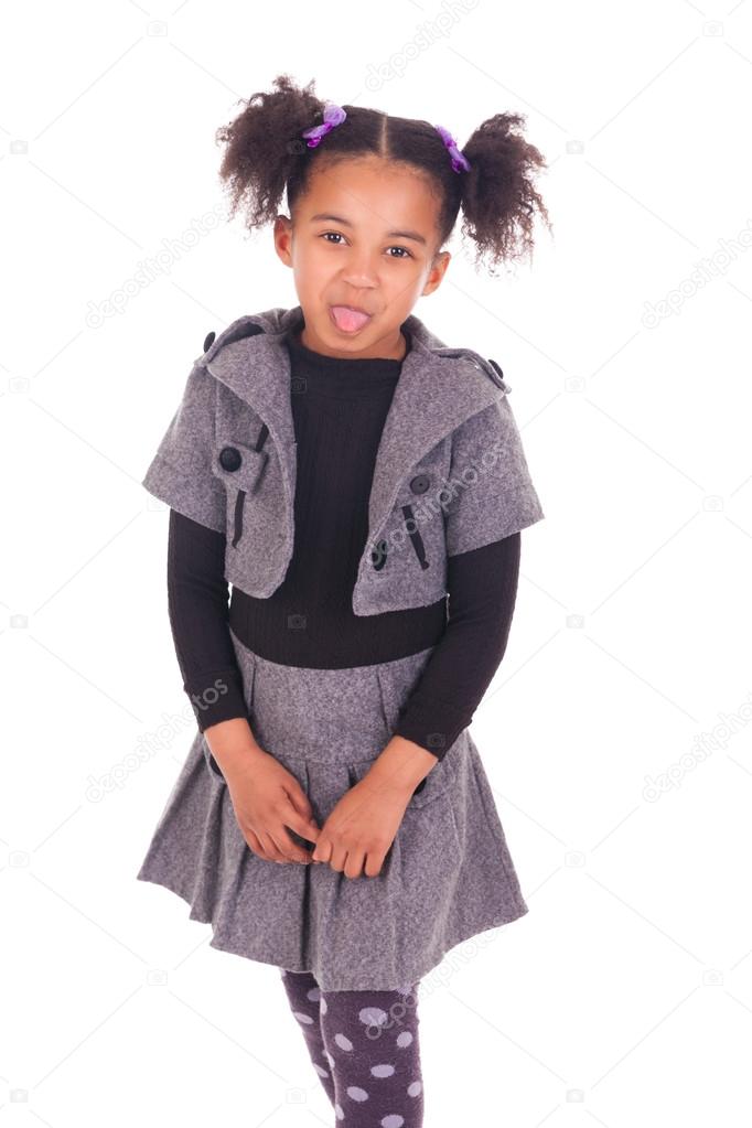 young African girl sticking tongue out, isolated on white backgr
