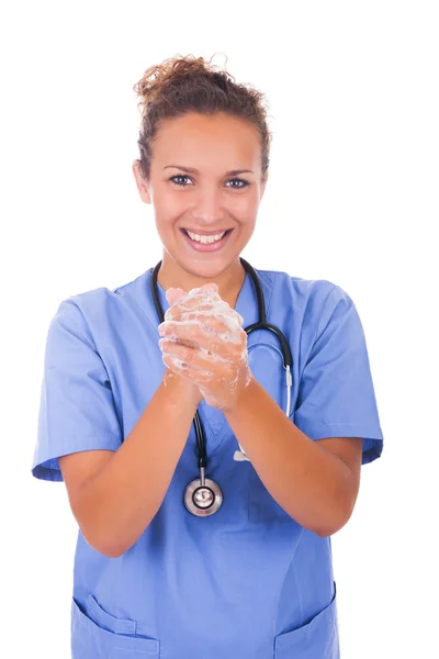 Young nurse washing hands with soap — Stock Photo, Image