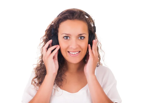 Woman listening to music with headphones Royalty Free Stock Photos