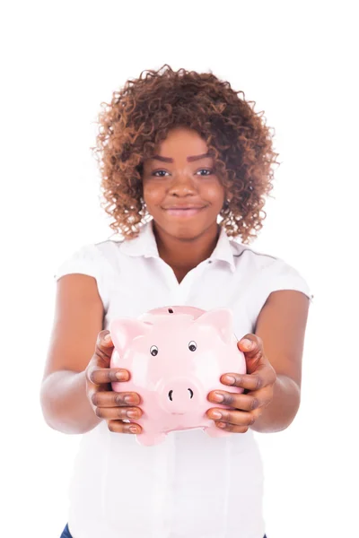 Happy Young Woman Saves Money in Piggy bank — Stock Photo, Image