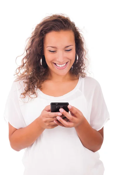 Happy woman texting on her phone Royalty Free Stock Images