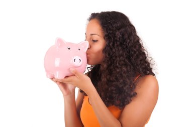 Young african american woman kissing piggy bank clipart