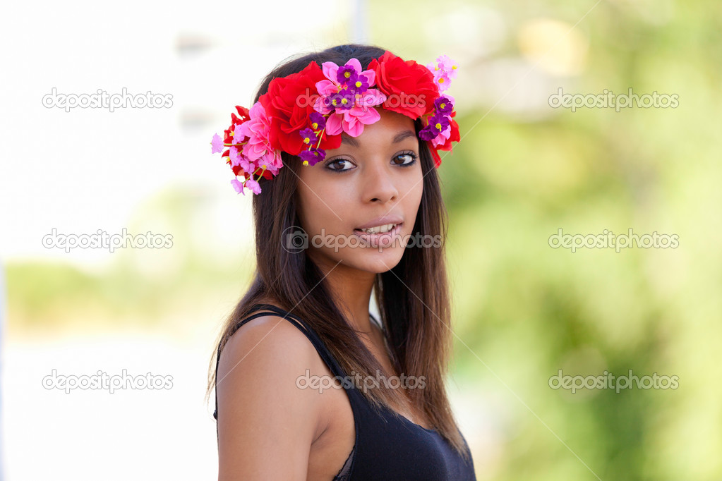 Portrait of a beautiful african young woman outdoors