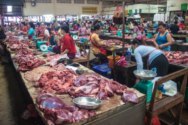 Meat for sale on a market in Pakse clipart