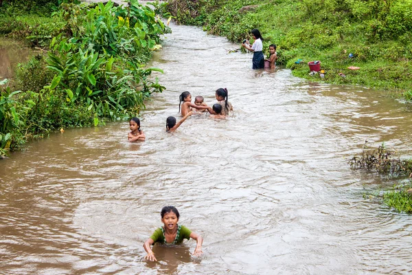 Locals bath in a river — Stock Photo, Image