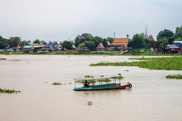 Stilt houses and a ferry — Stock Photo, Image