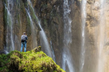 PLITVICE, CROATIA - MAY 24, 2019: Tourists visit Veliki Slap waterfall Plitvice Lakes National Park, Croatia