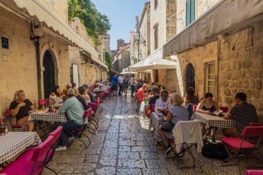 DUBROVNIK, CROATIA - MAY 30, 2019: Open air restaurant in the old town of Dubrovnik, Croatia