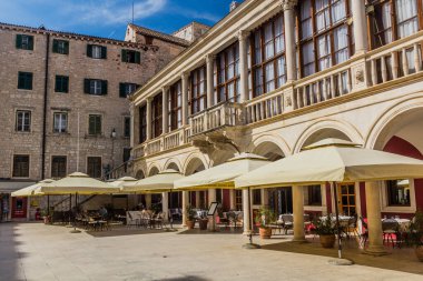 SIBENIK, CROATIA - MAY 25, 2019: Open air restaurant at Trg Republike Hrvatske square in Sibenik, Croatia