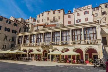 SIBENIK, CROATIA - MAY 25, 2019: Open air restaurant at Trg Republike Hrvatske square in Sibenik, Croatia