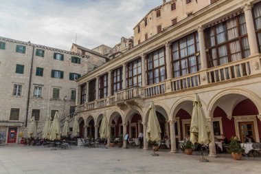 SIBENIK, CROATIA - MAY 25, 2019: Open air restaurant at Trg Republike Hrvatske square in Sibenik, Croatia