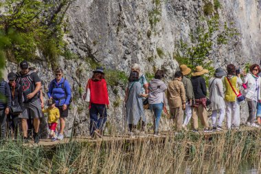 PLITVICE, CROATIA - MAY 24, 2019: Tourists visit Plitvice Lakes National Park, Croatia