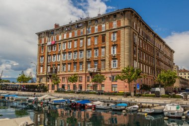 Small boats at Mrtvi canal and old buildings in Rijeka, Croatia