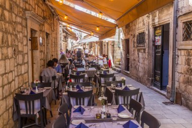 DUBROVNIK, CROATIA - MAY 30, 2019: Open air restaurant in the old town of Dubrovnik, Croatia