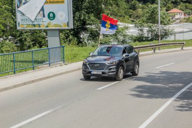 HERCEG NOVI, MONTENEGRO - JUNE 1, 2019: Car with the Serbian Orthodox Church flag in Herceg Novi, Montenegro.
