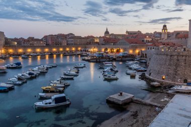 DUBROVNIK, CROATIA - MAY 31, 2019: Evening view of the boats in the old town of Dubrovnik, Croatia