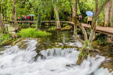 KRKA, CROATIA - MAY 26, 2019: Tourists visit Krka national park, Croatia