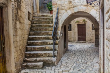 Narrow alley in the old town of Trogir, Croatia