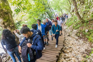 PLITVICE, CROATIA - MAY 24, 2019: Tourists visit Plitvice Lakes National Park, Croatia