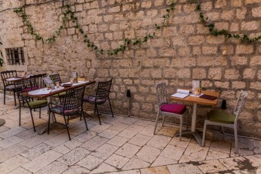 SPLIT, CROATIA - MAY 28, 2019: Open air restaurant in the old town of Split, Croatia