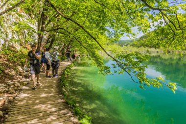 PLITVICE, CROATIA - MAY 24, 2019: Tourists visit Plitvice Lakes National Park, Croatia